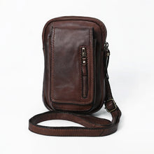 Load image into Gallery viewer, Front of dark brown Lainey Italian leather phone crossbody with front pocket and adjustable strap
