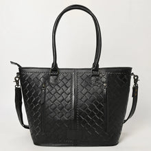 Load image into Gallery viewer, Back of the Maple Creek black tote showing basketweave-stamped leather, tooled handle tabs and two vertical zip pockets including the concealed carry pocket
