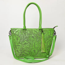 Load image into Gallery viewer, Maple Creek hand tooled leather concealed carry tote in green, front view with antiqued floral tooling, fringe tassel and strap
