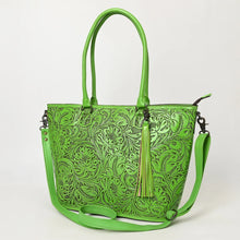 Load image into Gallery viewer, Maple Creek hand tooled leather concealed carry tote in green, angled view showing floral tooling, tassel and strap
