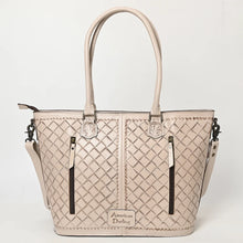 Load image into Gallery viewer, Back of the Maple Creek white tote showing basketweave-stamped leather, tooled handle tabs and two vertical zip pockets including the concealed carry pocket
