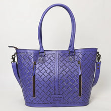 Load image into Gallery viewer, Back of the Maple Creek purple tote showing basketweave-stamped leather, tooled handle tabs and two vertical zip pockets including the concealed carry pocket
