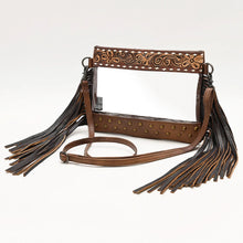 Load image into Gallery viewer, Brass Tacks hand tooled leather fringe clear crossbody purse in Brown with adjustable strap, angled view
