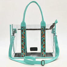 Load image into Gallery viewer, Turquoise Trail clear tote bag with turquoise leather trim and hand tooled floral strap accents
