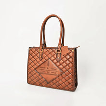 Load image into Gallery viewer, Hattie quilted leather tote, angled view with rolled handles and brass corner studs
