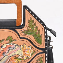 Load image into Gallery viewer, Close-up of the Moonflower purse corner showing hand-painted leaf tooling, moth wing detail, and white buck stitching
