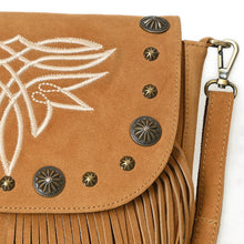 Load image into Gallery viewer, Close-up of the tan Sparrow purse's cream boot-stitch embroidery, brass conchos, star studs, and swivel clasp on suede
