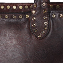 Load image into Gallery viewer, Close-up of Starla tote in espresso brown showing star-stamped antique brass studs on the topline and handle tab over full-grain leather
