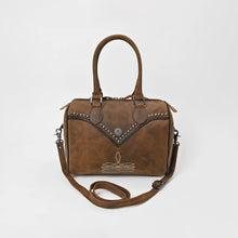 Load image into Gallery viewer, Bowie western satchel in distressed brown leather, front view showing the rolled top handles, black studded V-yoke with a starburst concho, cream sprig stitching, and the removable crossbody strap
