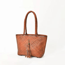 Load image into Gallery viewer, Saffron cognac woven leather tote with tassel, angled view
