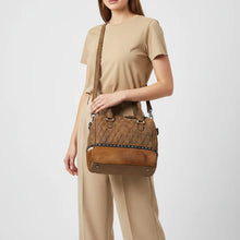 Load image into Gallery viewer, Woman carrying the Buckskin quilted leather and cowhide speedy satchel on the shoulder
