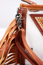 Load image into Gallery viewer, Close-up of the antique swivel clip, stitched leather strap and two-tone fringe on the Saguaro Sunrise clear purse
