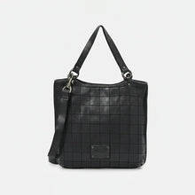 Load image into Gallery viewer, Back of the Winslow black Italian leather grid tote with embossed brand plate and crossbody strap
