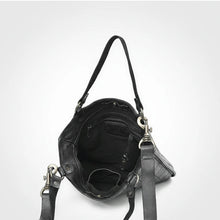 Load image into Gallery viewer, Inside the Winslow black leather tote showing snap-tab top, fabric lining, zip pocket, slip pocket and key clip
