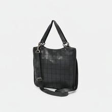 Load image into Gallery viewer, Winslow black leather windowpane grid tote, angled view with top handles and crossbody strap

