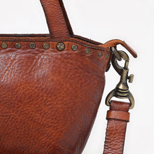 Load image into Gallery viewer, Model holding the Riva tan Italian leather riveted mini tote by the top handles
