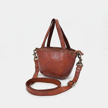 Load image into Gallery viewer, Riva tan leather riveted mini tote, angled view with top handles and adjustable strap
