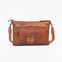 Load image into Gallery viewer, Back view of the Tawny tan leather crossbody with exterior zip pocket, antique brass swivel clips, and leather strap
