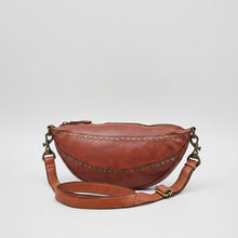 Load image into Gallery viewer, Front view of the Comet star studded half moon sling bag in cognac leather
