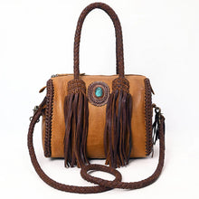 Load image into Gallery viewer, Reata turquoise braided fringe leather barrel satchel in Honey Tan, front view with two long chocolate fringe tassels, turquoise stone concho, and braided crossbody strap
