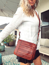 Load image into Gallery viewer, Washoe Lake brick-red leather crossbody shown on a model for size and fit
