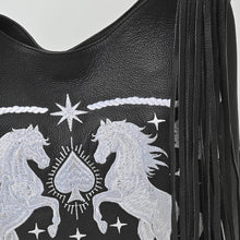 Load image into Gallery viewer, Melby black leather hobo bag with white embroidered rearing stallions and black fringe
