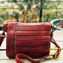 Load image into Gallery viewer, Washoe Lake brick-red Italian leather crossbody purse, front view with stitched horizontal pleats, a column of brass studs, and adjustable leather strap
