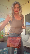 Load image into Gallery viewer, Model wearing the Venezia cognac Italian leather studded crossbody purse, showing crossbody fit and strap length
