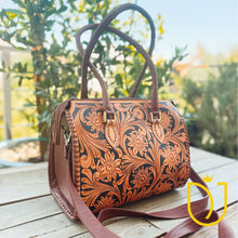 Load image into Gallery viewer, Whitby western leather handbag, angled view showing tooled floral design and braided edge

