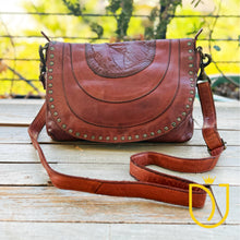 Load image into Gallery viewer, Venezia Italian leather crossbody purse in cognac with star-studded flap and adjustable leather strap, front view
