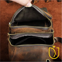 Load image into Gallery viewer, Drifter distressed leather sling bag unzipped to show two main compartments, canvas lining, and interior slip pocket
