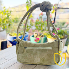 Load image into Gallery viewer, Emilie sage green suede western purse showing leather handle and zipper top

