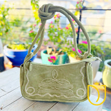 Load image into Gallery viewer, Emilie sage green suede boot stitch crossbody purse with white boot stitch design and adjustable strap

