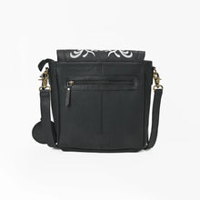 Load image into Gallery viewer, Back of the Raven black leather crossbody showing the exterior zip pocket and antique brass clasps
