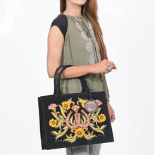 Load image into Gallery viewer, Woman carrying the Lady Luck embroidered horseshoe suede tote over her forearm

