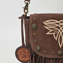 Load image into Gallery viewer, Close-up of the brown Sparrow purse's boot-stitch embroidery, brass conchos, star studs, and ball-chain fringe on suede
