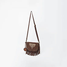 Load image into Gallery viewer, Brown Sparrow suede crossbody purse on its full strap, angled view showing fringe and side tassel
