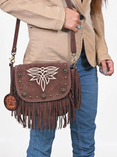 Load image into Gallery viewer, Close-up of a woman wearing the brown Sparrow suede fringe crossbody with chain fringe and suede tassel
