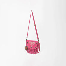 Load image into Gallery viewer, Pink Sparrow suede crossbody purse on its full strap, angled view showing fringe and side tassel
