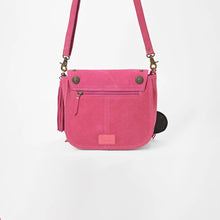 Load image into Gallery viewer, Back view of the pink Sparrow suede crossbody purse with exterior zip pocket and brass conchos
