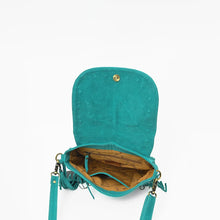 Load image into Gallery viewer, Inside the turquoise Sparrow suede crossbody, flap open showing magnetic snap, lined interior, and zip pocket
