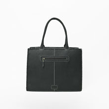 Load image into Gallery viewer, Back view of the Lacey tote in plain black leather with an exterior zip pocket and whipstitched edges
