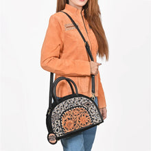 Load image into Gallery viewer, Woman wearing the Tiara beaded hand tooled dome satchel crossbody with a suede jacket
