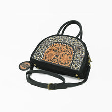 Load image into Gallery viewer, Tiara beaded suede satchel showing protective metal feet and adjustable leather strap
