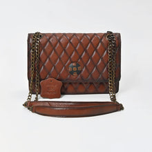 Load image into Gallery viewer, Sorrel quilted leather concho chain shoulder bag, front view with leather shoulder rest
