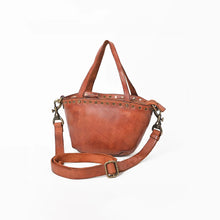 Load image into Gallery viewer, Riva cognac leather riveted mini tote, angled view with top handles and adjustable strap

