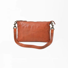 Load image into Gallery viewer, Front view of the Tawny cognac slim Italian leather crossbody with zip top, antique brass swivel clips, and stitched leather strap
