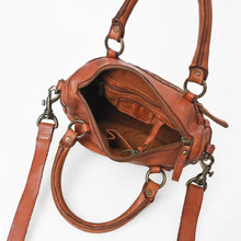 Load image into Gallery viewer, Top-down view inside the Clementine cognac leather satchel showing the open zip top, interior zip pocket, slip pocket, and rolled top handles
